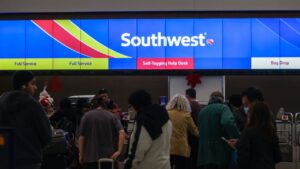 What's behind Southwest Airlines canceling flights and why are airline employees sleeping on the floor?